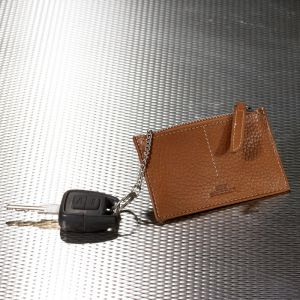 Key case with zip fastener